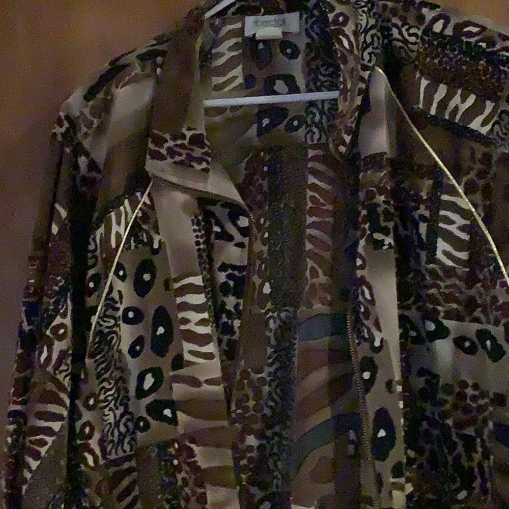 Women’s blazer jacket multicolor with black, white, brown and beige.